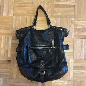 Tano Handbag -black leather, brown accents and metal rings